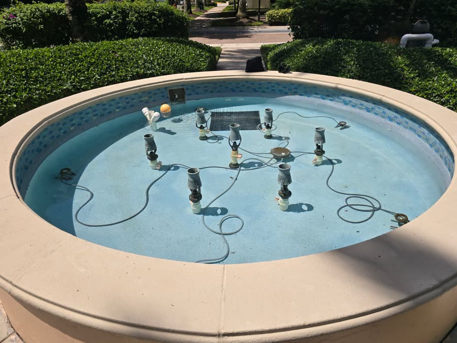 Round commercial fountain basin with multiple water jets